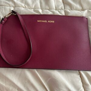 MK wristlet. Red wine color never used